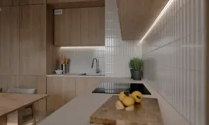 Białe, pionowe płytki między szafkami w kuchni, tworzące elegancką mozaikę.